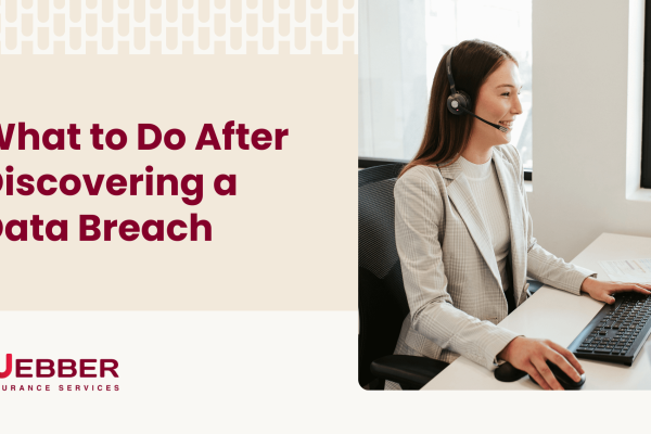 A woman wearing a headset and a light-colored blazer sits at a desk, typing on a keyboard. Next to her on the screen are the words "What to Do After Discovering Data Breaches" and the logo for Webber Insurance Services.